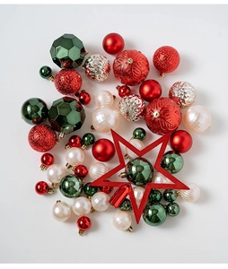 Flat lay of 50 mixed Christmas ball ornaments and tree topper star in red, green and silver