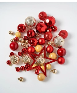 Detailed view of red and gold Christmas ball ornaments with glitter and matte finishes