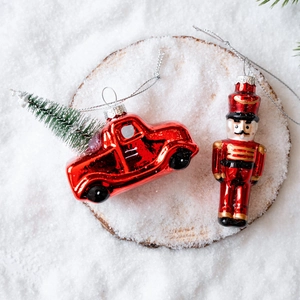 Christmas glass ornaments set featuring a red vintage car and a Nutcracker soldier figure