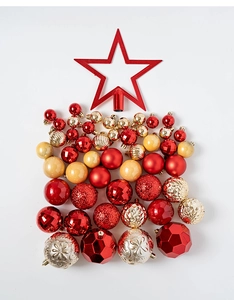 Close-up detail of red star tree topper and assorted electroplated Christmas ornaments