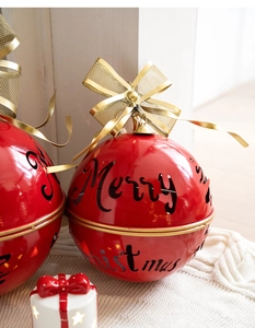 Macro detail of red Merry Christmas metal bell with golden bow and internal LED lighting
