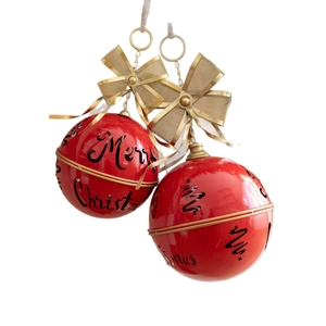 Set of two red metal Christmas bells with hollow Merry Christmas text and golden bows