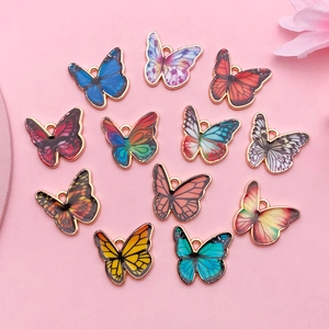 Detailed view of colorful butterfly alloy pendants for DIY necklace and bracelet jewelry