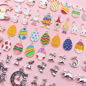 Close-up of assorted colorful enamel Easter bunny and egg charms for DIY jewelry making