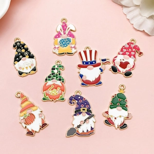 Detailed flat lay of colorful enamel gnome charms for various holidays and DIY jewelry