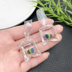 Detailed shot of creative clear water bag charm with colorful tropical fish inside