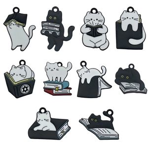Enamel cat charms collection featuring black and white cats with books for DIY jewelry