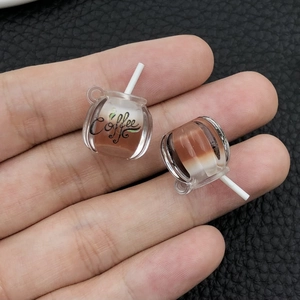 Macro view of luminous coffee cup resin charms for DIY keychains and jewelry making
