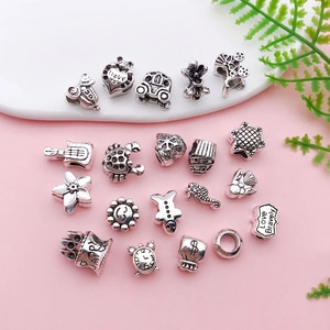 Retro Tibetan silver alloy charms set with hearts and flowers for DIY jewelry making