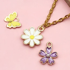 Hollow flower and butterfly pendants for DIY jewelry making in various vibrant colors