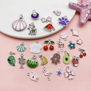 Assorted colorful enamel charms including fruit and animal shapes for DIY jewelry making