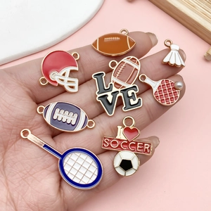 Detailed macro view of colorful sport-themed alloy charms for DIY jewelry and keychains