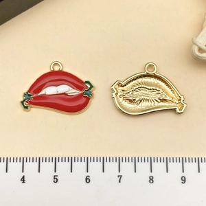 Detailed view of red lips enamel pendant with alloy metal backing for DIY crafts