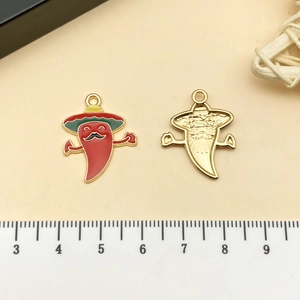 Macro detail of red chili pendants with straw hats and polished gold back for DIY