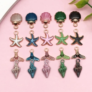 Detailed close-up of colorful ocean-themed enamel charms for DIY jewelry making