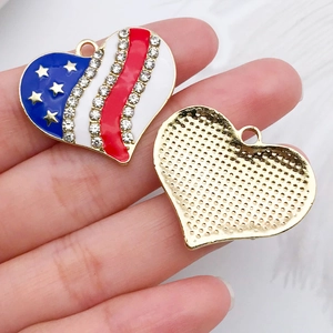 Macro detail of heart-shaped US flag pendant with sparkling rhinestones and golden base