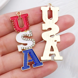 Macro shot of USA letter pendants with red white blue enamel and rhinestones