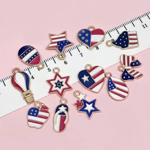 Set of 12 American flag charms in heart and star shapes with gold-plated alloy edges