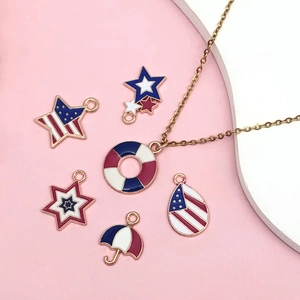 Golden American flag charms with red white and blue enamel in heart and star shapes
