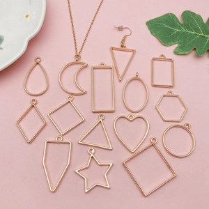 Close-up of 14 rose gold geometric alloy frames for DIY resin pendant and jewelry making