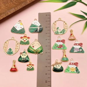 Detail of Dragon Boat Festival metal pendants with Zongzi motifs and charms