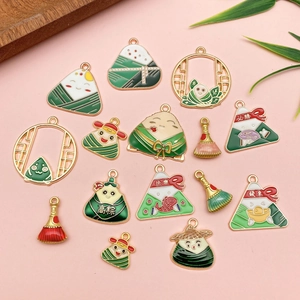 Dragon Boat Festival alloy charms with zongzi shapes and lucky text on pink backdrop