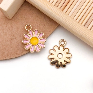 Detail of pink daisy flower charms with gold plating for DIY jewelry making