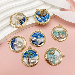 Macro shot of ocean-themed resin alloy pendants with faux pearls and sea elements