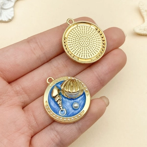 Macro detail of alloy ocean pendant featuring seashells and pearls for DIY jewelry
