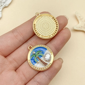 Macro view showing both sides of a tropical palm tree ocean pendant with pearl accents