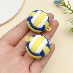 Close-up of miniature blue white and yellow volleyball pendant for DIY keychains