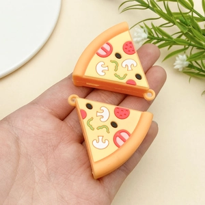 Close-up of DIY pizza pendants with detailed colorful mushroom and pepperoni toppings
