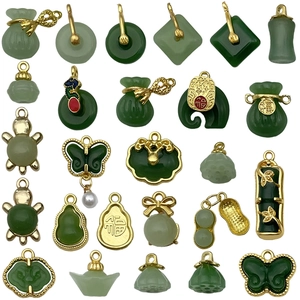 Assorted green faux jade and gold alloy pendants in traditional Chinese retro styles