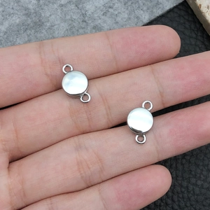Detail of silver zinc alloy magnetic heart clasps for DIY jewelry making and bracelet connectors