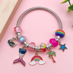 Colorful resin bead bracelet with black swan and rainbow pendants on silver spring coil