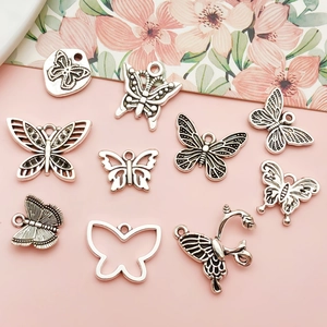 Dieci ciondoli a farfalla in argento vintage per collane fai-da-te e bigiotteria