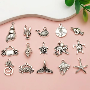 Detailed set of 15 antique silver ocean charms including starfish and turtles for DIY crafts