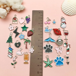 Set of colorful enamel alloy pendants featuring ocean, fruit, and holiday shapes
