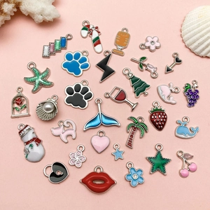 Close-up of assorted colorful enamel alloy charms with ocean and floral motifs
