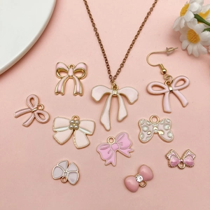 Pink enamel bow pendant set with gold alloy necklace and charms for DIY jewelry making