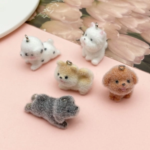 Detailed view of five cute flocked dog pendants including Teddy and Dalmatian styles