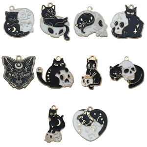 Set of 10 black and white enamel cat and skull charms with gold metal edges for DIY jewelry