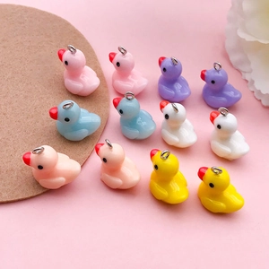 Set of 12 colorful resin duck pendants with metal loops for DIY jewelry making
