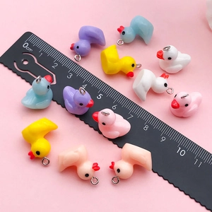 Mini resin duck pendants in various colors with metal rings for DIY jewelry making