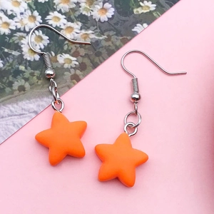 Vibrant orange matte resin star drop earrings with silver hooks for daily casual wear