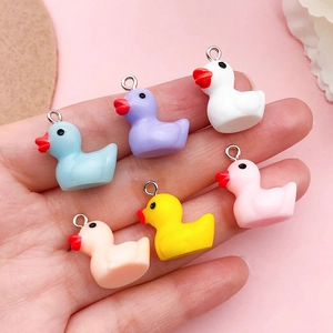 Set of six colorful mini resin duck pendants with silver metal loops for DIY jewelry