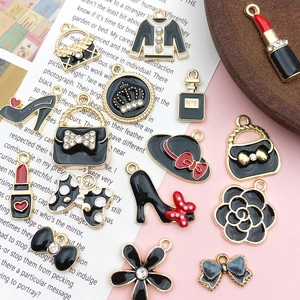 Macro detail of alloy charms with rhinestones and pearls for DIY jewelry crafts