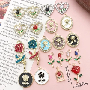 Detailed macro view of assorted enamel rose flower charms with gold plating for DIY jewelry