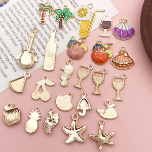 Close-up of colorful enamel summer-themed alloy charms for DIY jewelry making