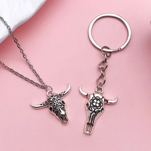 Antique silver bull skull pendant necklace and keychain set with sunflower engravings